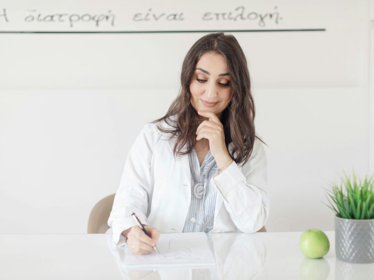 A Doctor Sitting and Writing