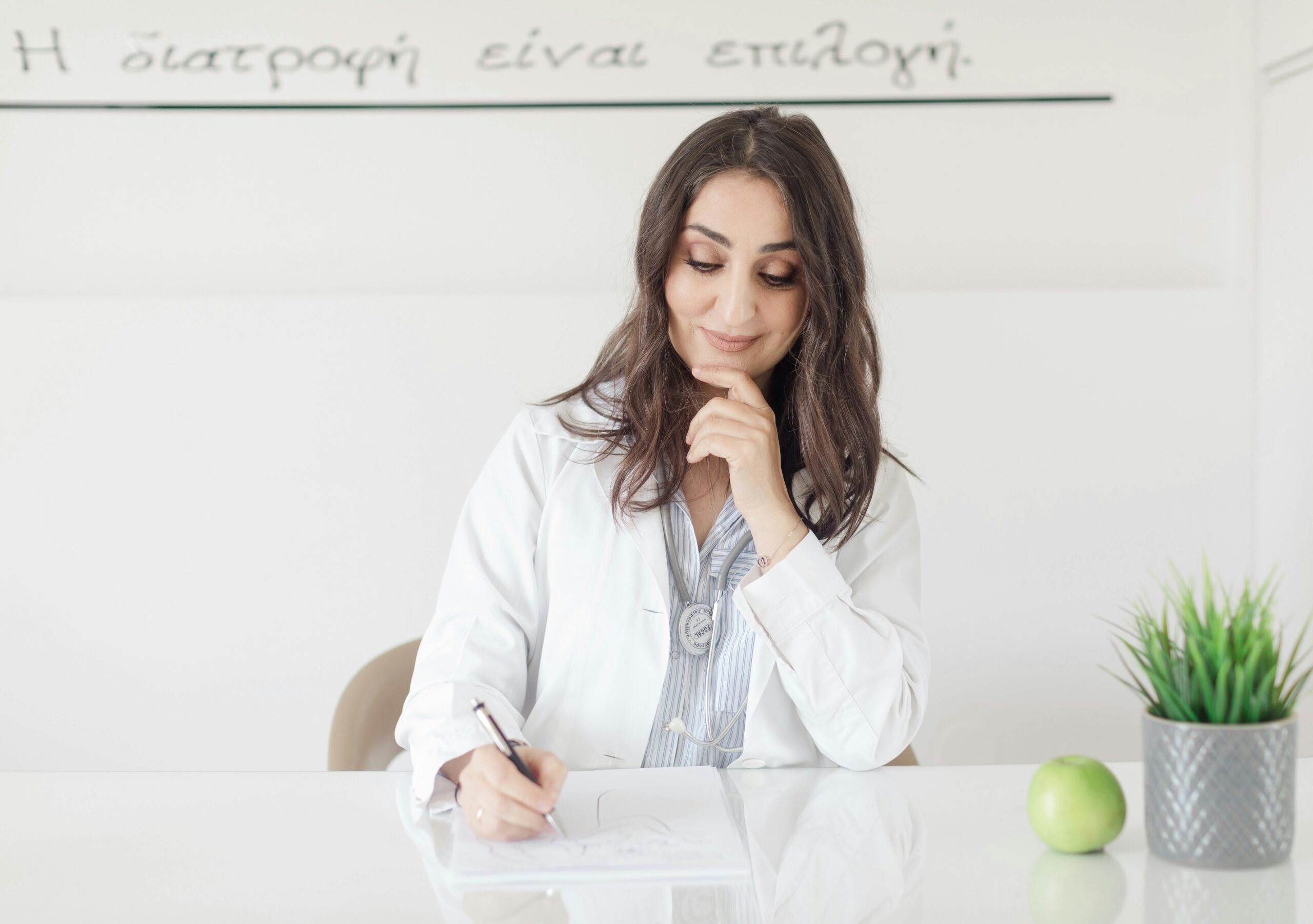 A Doctor Sitting and Writing